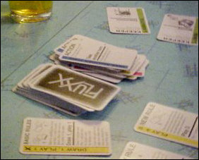 When playing Fluxx, you have several different cards. Yellow "new rule" cards, which dictate new rules such as hand limits, keeper limits, card selection rules, etc., pink goal cards which determine a certain goal to reach to win the game, green "keeper" cards, and blue "action" cards. All rules and goals are subject to change at any time.