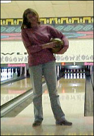 Another glamour shot - Laura Jane prepares to throw the ball, but first takes a moment out to smile for the camera.