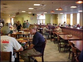 The former dining room #3 holds similar furnishings. Here you can get a good look at the half-booths. They also have full booths along the wall behind me (from this vantage point).