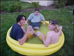 Rub-a-dub-dub, three men in a... swimming pool.