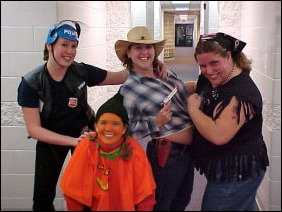 What a festive bunch! A pumpkin, a police officer, a cowboy, and a biker.