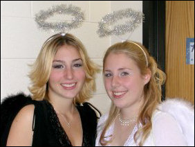 Aimee (at right) and her sister dressed up as an angel and a fallen angel.