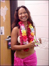 Linda went dressed up in Hawaiian-wear, posing first with one Lei on, and then got two more Leis to wear when going out.