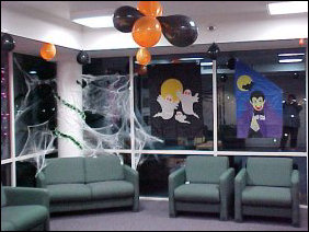 In the corner, we find more spider webs, as well as more balloons and festive decor - flags and stick-ons and such.