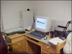 Next to the bed, in the corner, is the productivity section. The computer and all of its goodies. Nine times out of ten, the thing I'm looking for is either in the desk or somewhere on my computer.