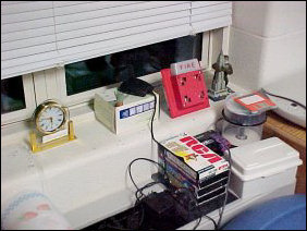 And on the windowsill, various personal effects. King Kong posing with the Empire State Building, aWheelock 7002T from my Fire Alarm Collection, and the experimental window-cam.