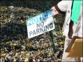 This no-parking sign is technically meaningless, since the owner of the property at this location put the sign up in front of a public street, in order to reserve a parking space for himself on the street. Thus if I wanted to park in the same spot, he would have no legal recourse.