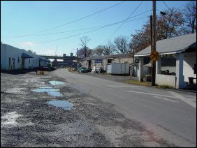 Continuing along Chesapeake Avenue, we find more industrial area, and then passed over the railroad tracks, and under the Talmage R. Cooley bridge back to Grace Street.