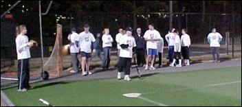 The team watches intently as Johnny steps up to the plate...