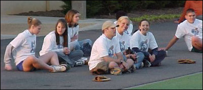 And as everyone bats, the team watches on the sidelines...