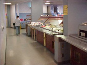 The buffet in this room serves traditional dinner-fare. On this particular day for the dinner meal, two of the vegetable items offered were mashed potatoes and green beans.