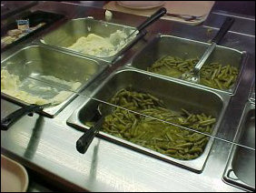 The buffet in this room serves traditional dinner-fare. On this particular day for the dinner meal, two of the vegetable items offered were mashed potatoes and green beans.