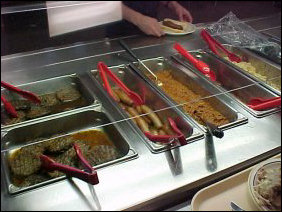 The buffet in this room serves hamburgers, hot dogs, chili, French fries, onion rings, nachos (including cheese), and the like. It's a good stop for lunch!