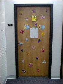 This door, covered with flowers, adds a nice touch to any hallway.