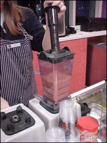 And of course to persuade the smoothie to get properly mixed, Beth is properly equipped with a pushing-around device that is guaranteed not to get her fingers chopped off.