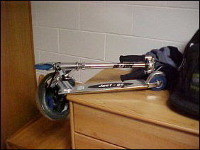 And my scooter takes residence... when this picture was taken, I was between roommates, and so the scooter is sitting on the other dresser.  Usually, it's on the floor.