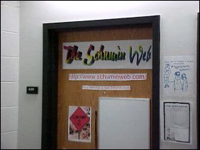 As mentioned above, the door is similar to last year, but things changed since the first picture was taken.  For one thing, I got settled into www.schuminweb.com, and my new slogan, "It's a new day, a new Schumin Web" is on the door.  You can see a close-up of the top of the door below...