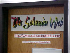 As mentioned above, the door is similar to last year, but things changed since the first picture was taken.  For one thing, I got settled into www.schuminweb.com, and my new slogan, "It's a new day, a new Schumin Web" is on the door.  You can see a close-up of the top of the door below...