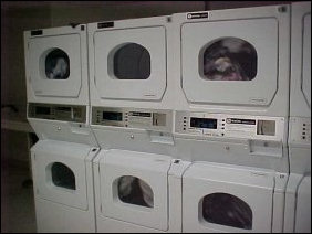 The laundry room here is definitely equipped for more people... seven washers and eight dryers.  The nice thing about this is that you can watch your clothes get dry... and count the laps that your pair of pants takes... 1,763, 1,764, 1,765...