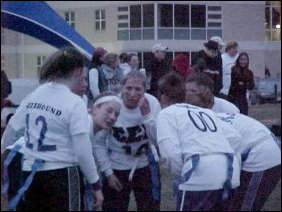 As with any football game, a huddle is necessary in order to communicate strategies to kick Sigma Kappa's butt.