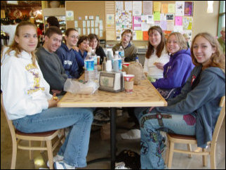 The next day, we again stopped at Whole Foods for breakfast, and had our bagels, fruit, and coffee, and such for the morning. Note how Spencer made an amusing face there in the back.